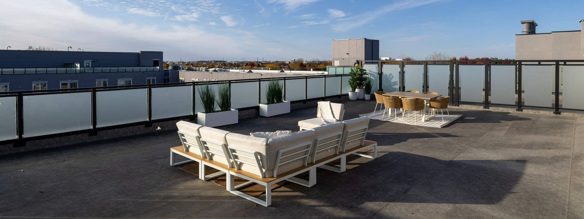 Private penthouse terrace with lounge seating and open-sky views